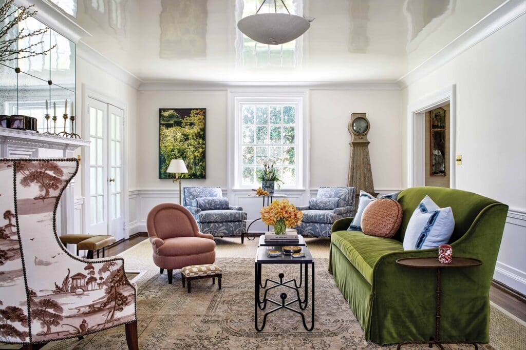 Living room of this antique and modern Charlottesville home, with a lacquered ceiling and muted, but colorful, furniture.