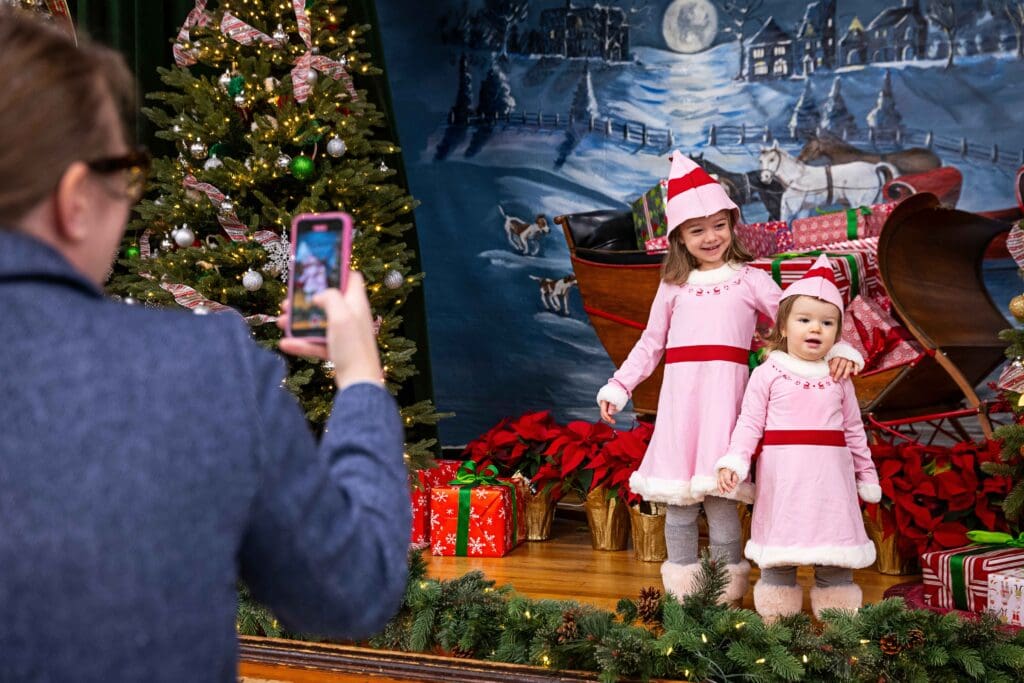 Kids dressed like elves get their picture taken